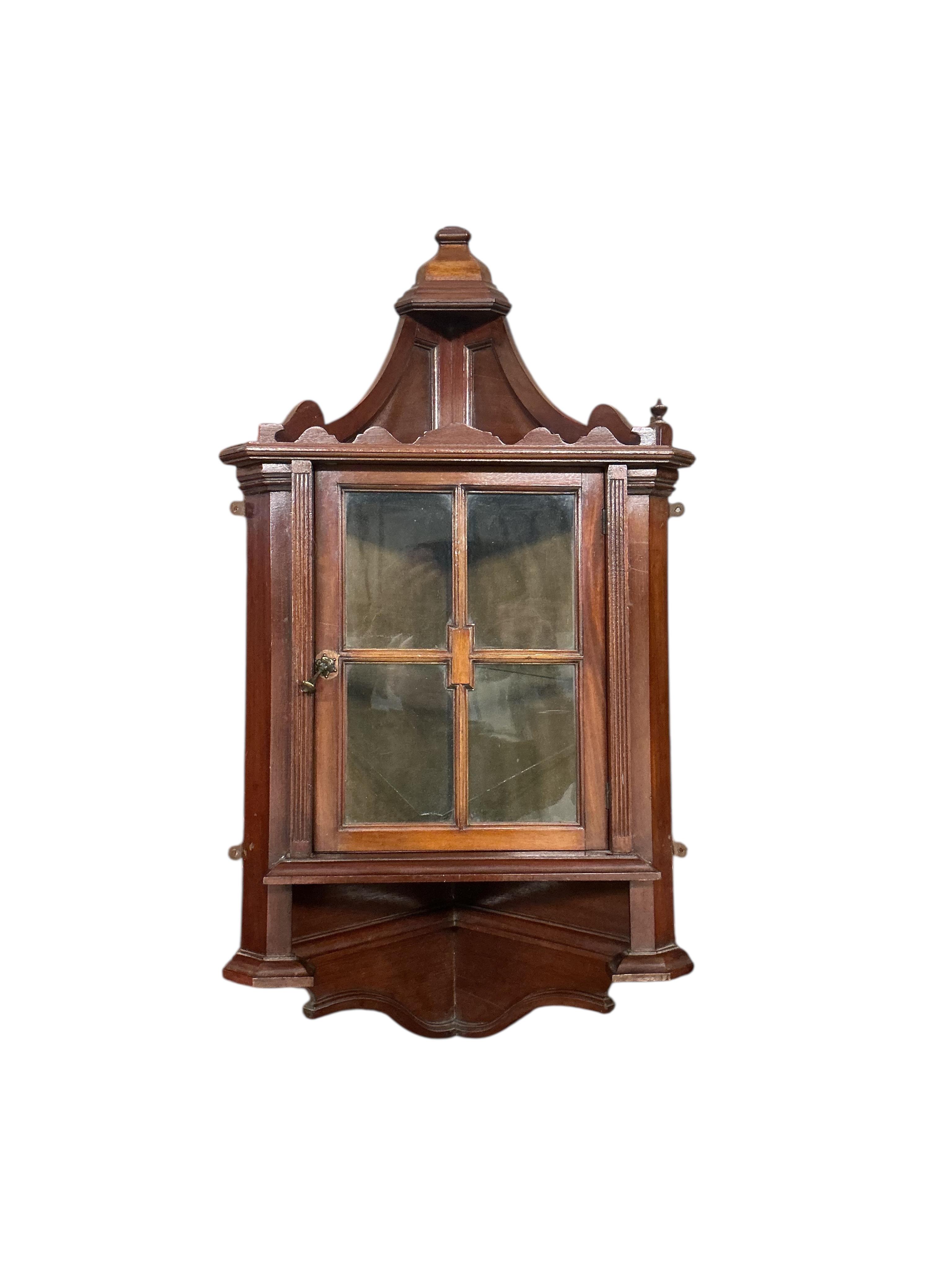 A pair of small late Victorian mahogany hanging corner cabinets, width 48cm, depth 26cm, height 96cm